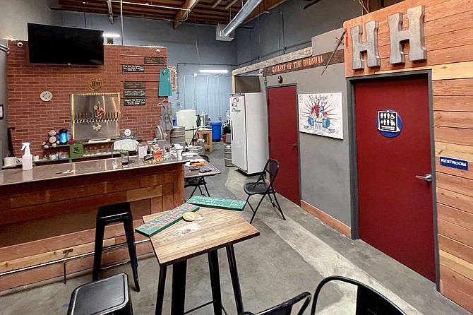An old school type of San Diego taproom, inside a warehouse at the edge of town
