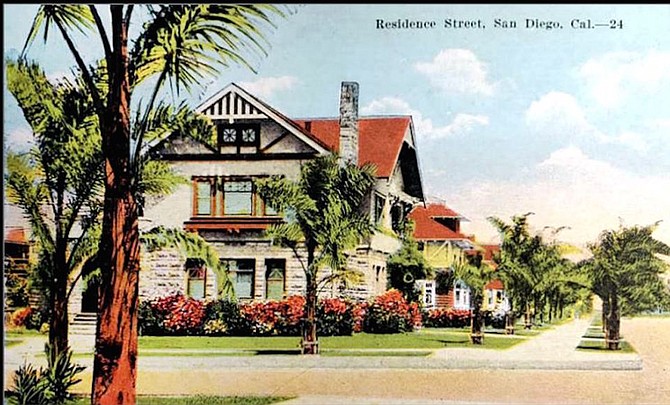 The house, featured on a 1909 postcard, melds Tudor Revival, Craftsman, and Richardsonian Romanesque styles.