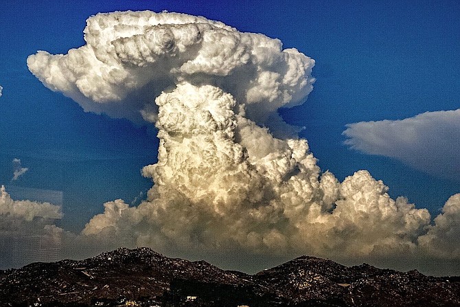 Cumulonimbus clouds viewed over mountains from National Weather Service, San Diego