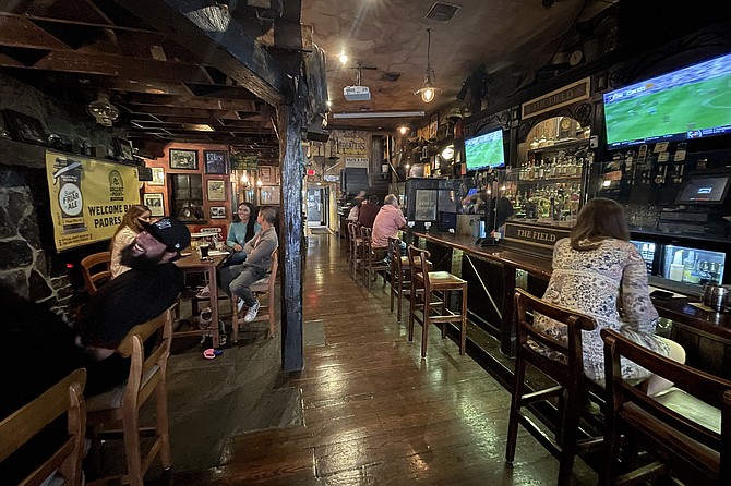 Inside The Field, day drinkers can still pretend it's night.