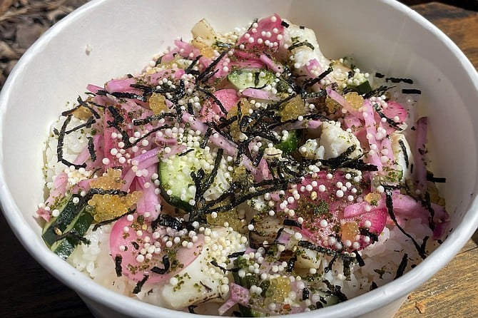 A chirashi rice bowl topped with miso marinated black cod, and more