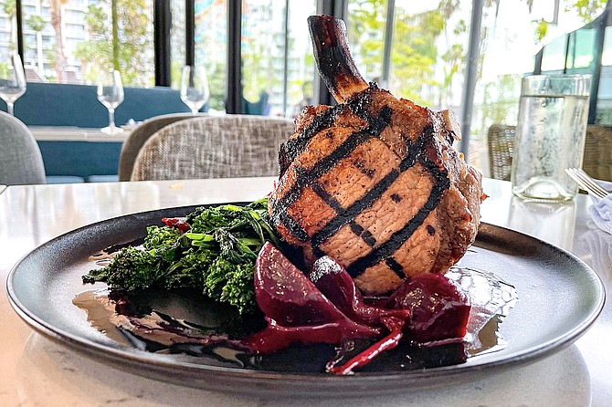 Perfect grill marks on a bone-in Berkshire pork chop