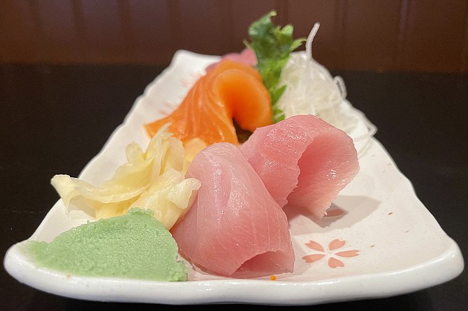 A $12 sashimi combo featuring ahi tuna, salmon, and yellowtail