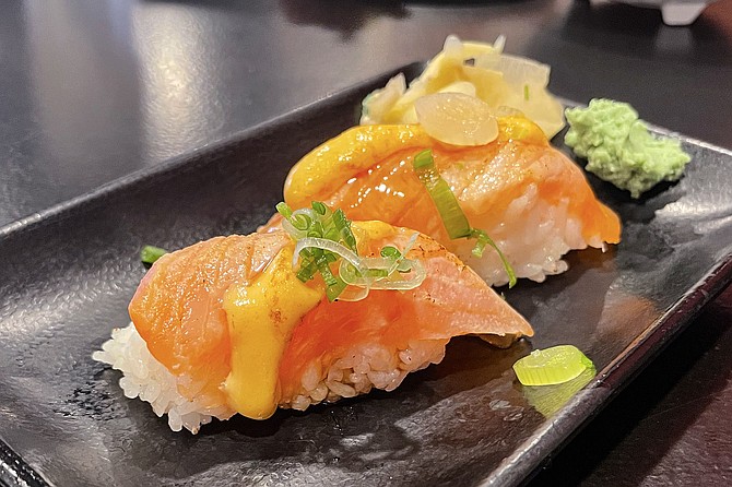 Asahi beer and a seared salmon nigiri happy hour special, $7.50 total