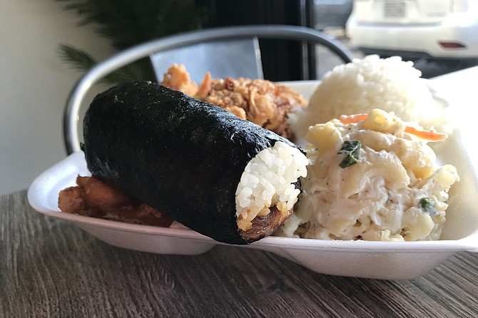 TF Spam Musubi sits on Korean chicken plate.jpg