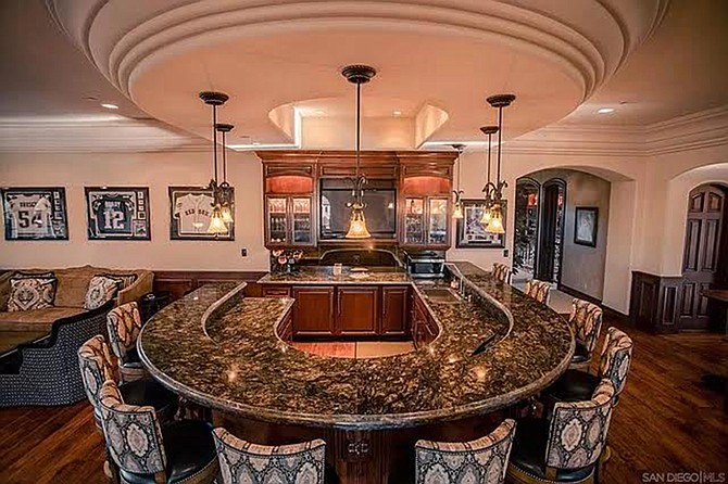 Some people drink at home. Some people drink at a bar. If you live here, you can do both at the same time!