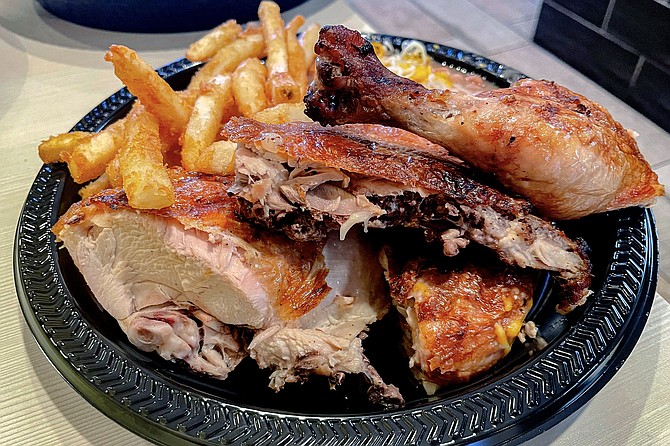 The half chicken combo, with uncommonly crispy charbroiled chicken (and fries)