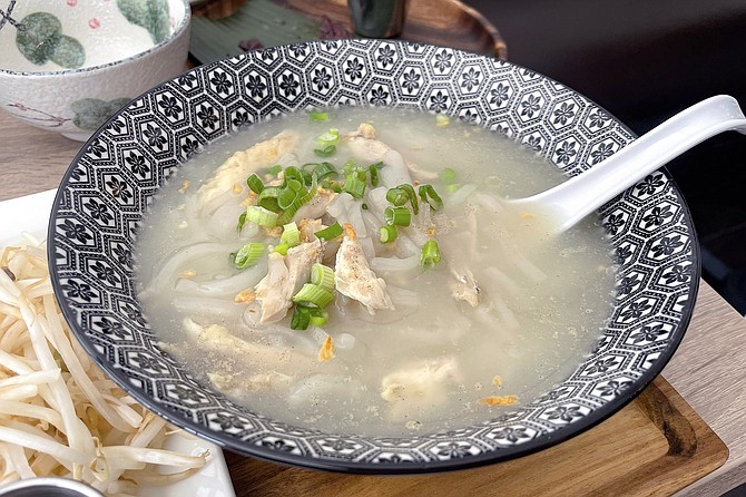 Thick, homemade rice noodles in a garlicky chicken soup