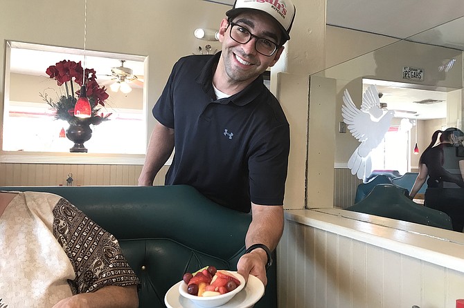 Owner Fred Soleimani’s son Nima brings fruit for Mag.
