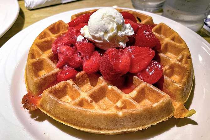 A Spot Waffle, topped with strawberries