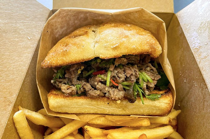 The Steve sandwich features tender, grilled sirloin, chili, vinegar, and cilantro.