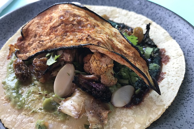 Rainbow cauliflower taco. Cauliflower “bacon” on top.