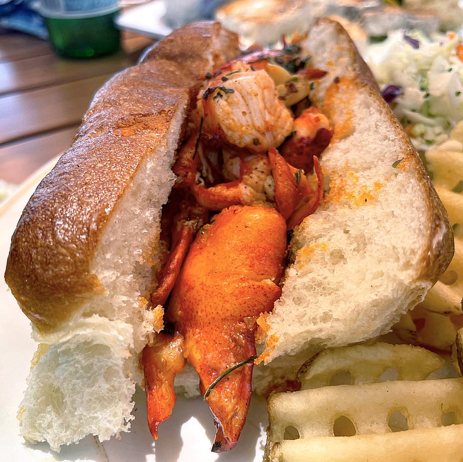 A hunk of claw meat contributes to a memorable Maine lobster roll.
