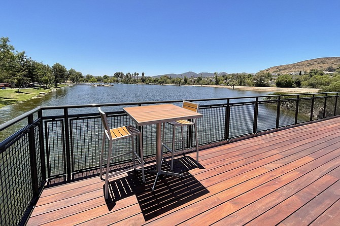 A two person table perched over Santee Lake #4, the new Tin Fish restaurant location