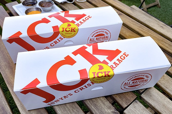 Red and white cardboard boxes of fried chicken