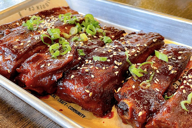 Baby back ribs glazed with spicy Korean gochujang paste