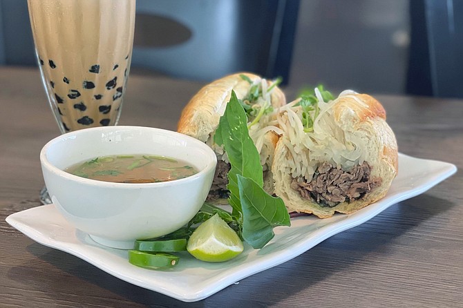 Beef banh mi served with a beef phở dip