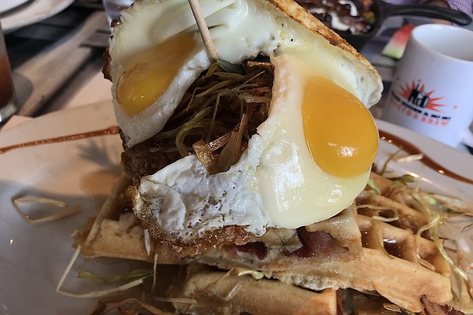 My two eggs atop my chicken and waffle tower - beautiful mess.