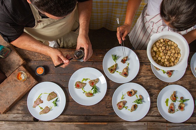 “Ah, the mushrooms; each piece gets a different mushroom. Is this too much salt?” The plate was a tiradito de jurel, raw Spanish mackerel covered in herbs, topped with two types of caviar and a mushroom (lightly salted).