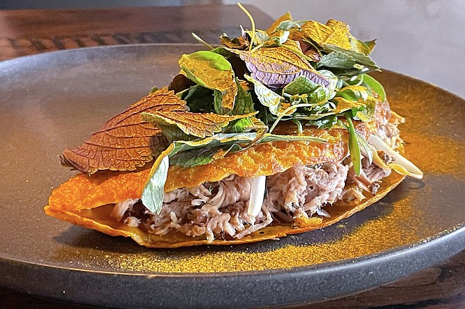 Leafy herbs and turmeric powder add jolts of color and flavor to this Vietnamese inspired pork crepe.