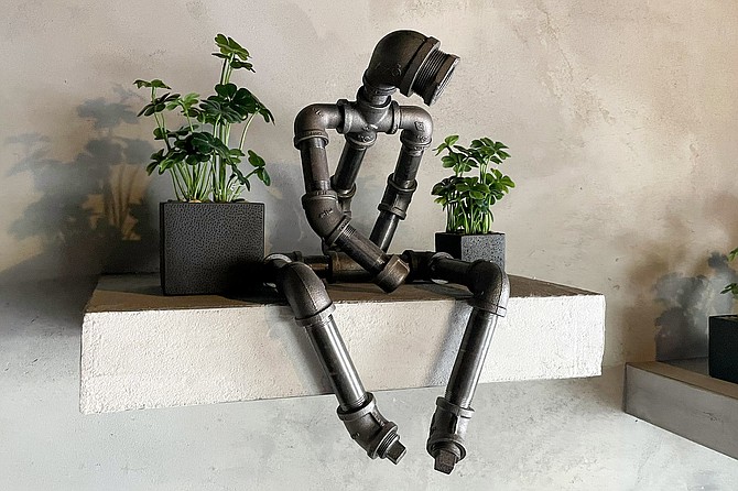 A somehow brooding metal pipe sculpture