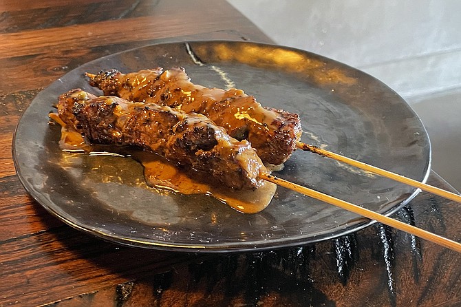 Phuket au poivre ribeye skewers, just off the charcoal grill