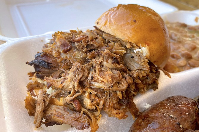 Way more pulled pork than can fit on a slider bun