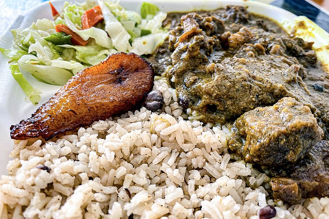 A goat curry featuring whole allspice berries
