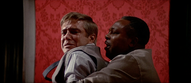 Jedidiah (Archie Moore) saves Mr. Jonas (George Peppard) from his past.
