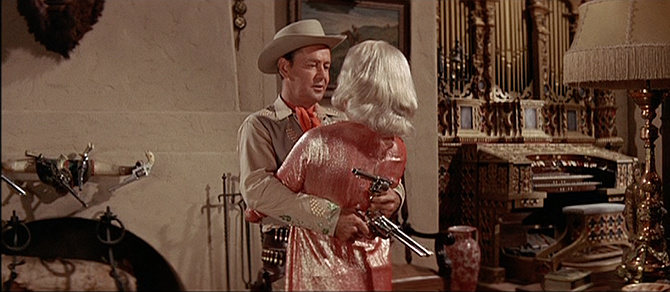 Nevada (Alan Ladd) knows how to show Rina (Carroll Baker) a good time.