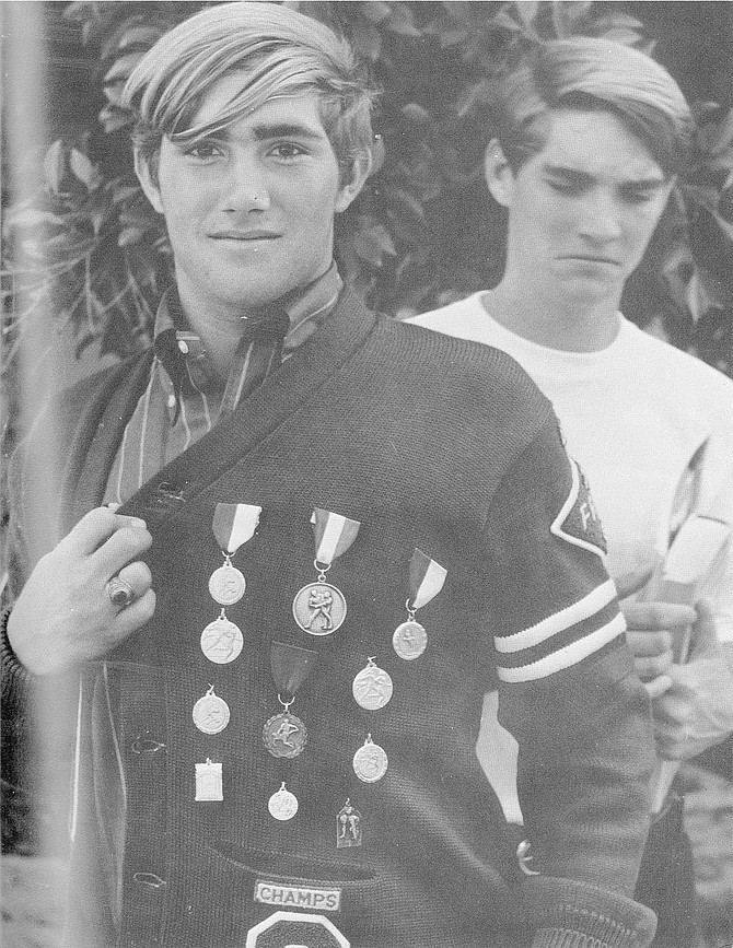 Louie in ’71 with OHS wrestling awards.
