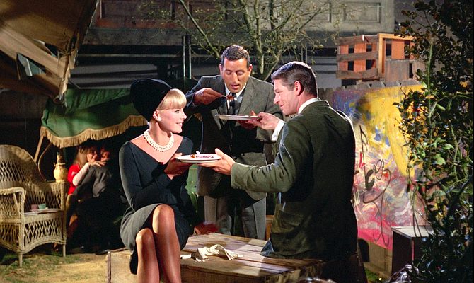 Dinner for two: Elke Sommer, Tony Bennett, and Stephen Boyd.