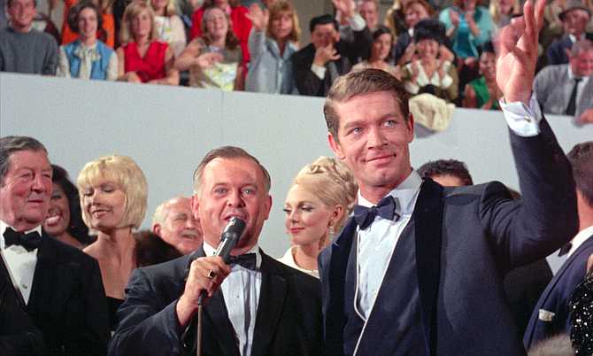 Hollywood glad-hander and Honorary Mayor of Hollywood, Johnny Grant, walking around in the same mud holes as Frankie Fane (Stephen Boyd).