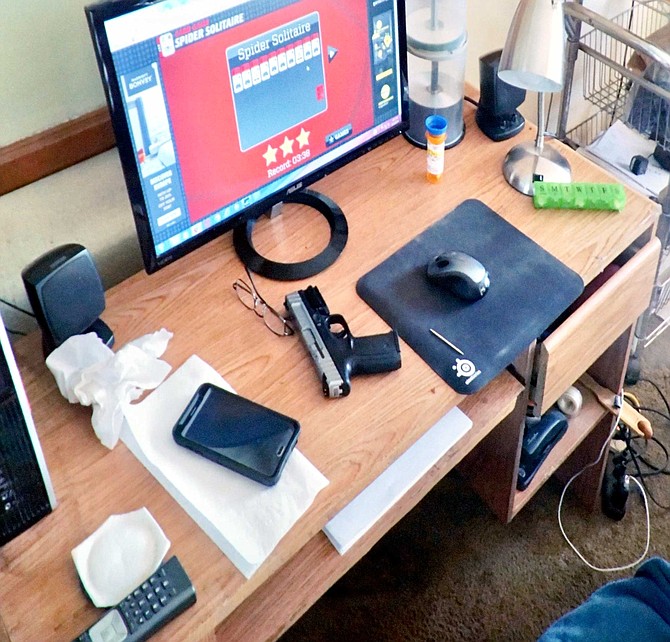 Andy and Jean had side by side desks, positioned so that Andy had a view of the back of his wife’s big swivel chair. While he drank and watched the movie, Andy rested his gun on his desktop.