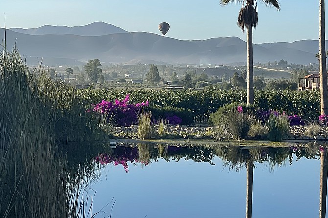 I attempt some Spanish. He chuckles at the attempt, and says, “You are in Mexico!” before opening the gate. Our villa overlooks a pond. In the distance, hot air balloons dot the sky.