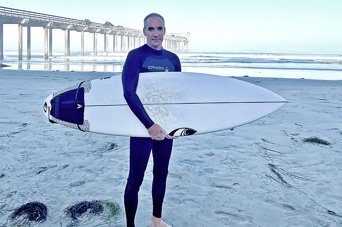 52-year-old Private Investigator Dave O’Connor surfs Scripps pier.