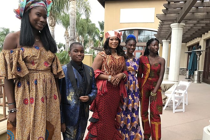 Bénie (center) and her four kids, in west African styles
