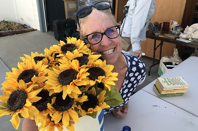 Lori and her $6 sunflowers. “But I’m just thrilled to see inside.”