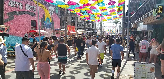 On August 10, three days before the beach festival began, the festival’s Facebook handler posted, “In addition to uploading proof of vaccination or a negative covid test, we ask you to please bring your face mask and positive vibes. Masks are required at all times — unless eating or drinking.”