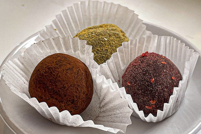Chocolate truffles made with (left to right) cherry and vanilla, turmeric, and raspberry