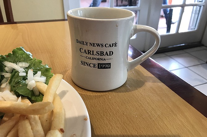 It’s on the mug: DNC’s 31-year history.
