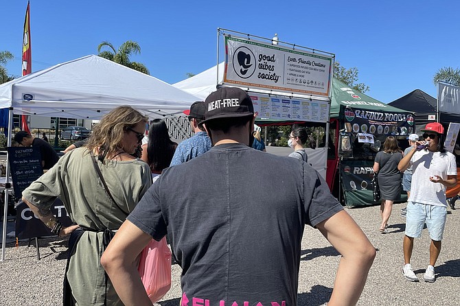 A line forms to try OmniPork plant based pork, at the monthly Encinitas Vegan Pop-Up (3rd Saturday of each month).