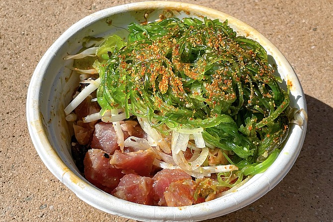 Tuna poke with sweet onions and seaweed salad, the most familiar item on Sweetfin's poke menu