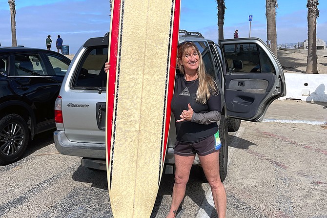 55-year-old Leanne Tibiatowski surfs Ocean Beach.