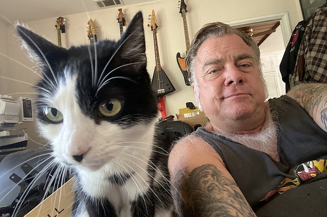 Mike “Spike” Muellenberg and Dodger: the man made it out alive; the cat, alas, did not.