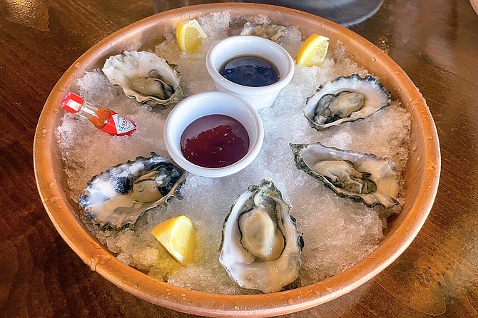 Happy hour oysters, priced $2 apiece