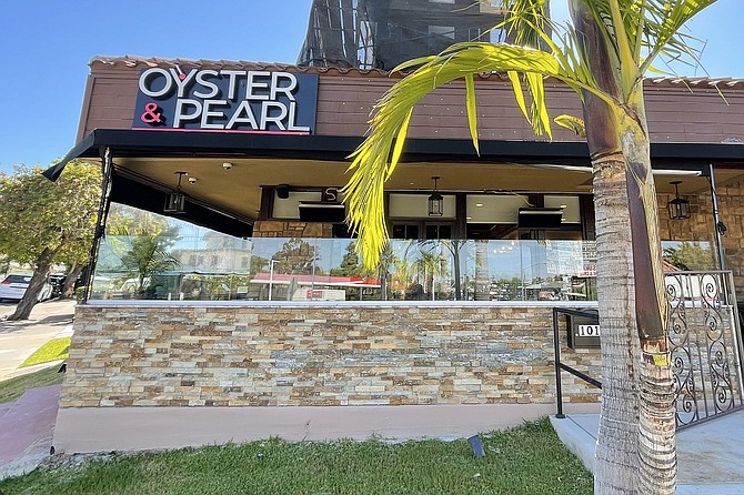 A new name and storefront for the restaurant formerly known as The Vine Cottage