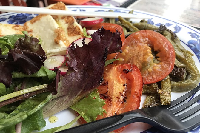 Roasted tomatoes and seared cheese slabs anchor the Queso Asado ($10). Filling app!