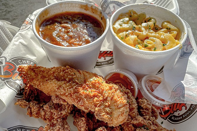 A chicken tenders combo with beefy beans and cheesy macaroni