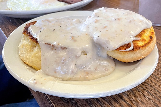 House-baked biscuits under a thick coat of sausage gravy